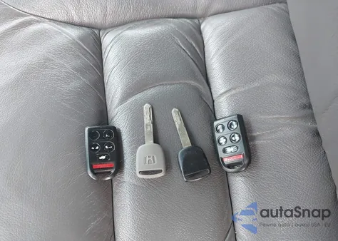 2010 Honda Odyssey Ex-L z USA, uszkodzony, nr VIN 5FNRL3H62AB052919